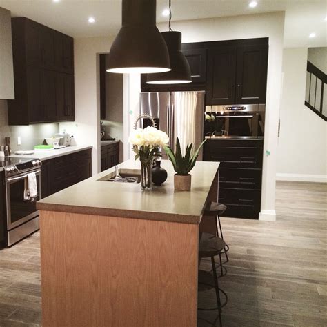 Black ikea kitchen with a DIY wood island | Black ikea kitchen, Ikea kitchen, Wood island