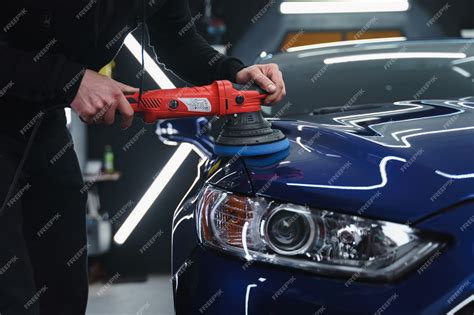 Premium Photo | Polishing car after painting Detailing car from the outside Device for polishing ...