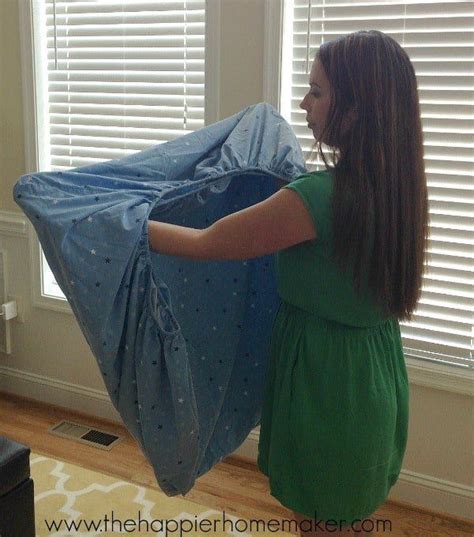 Fold a fitted sheet neatly is so easy once you learn how. With this easy step-by-step tutorial ...