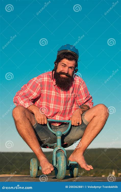 Funny Crazy Hipster Guy Riding a Small Bicycle. Man on a Childrens Bike. Funky Cyclist Riding ...