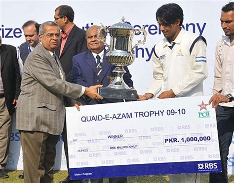 Karachi Blues captain Mohammad Sami with the Quaid-e-Azam Trophy and winner's cheque ...