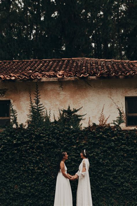 Two Women in Wedding Dress Holding Hands · Free Stock Photo