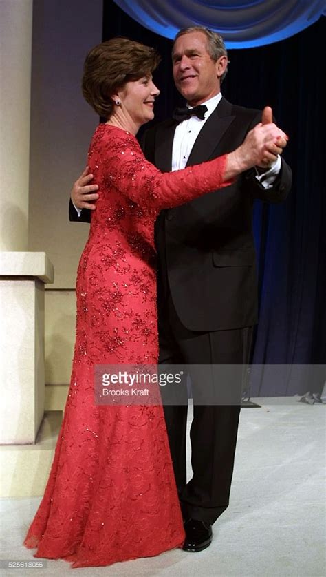 United States President George W. Bush and his wife, Laura, dance at the first inaugural ball in ...