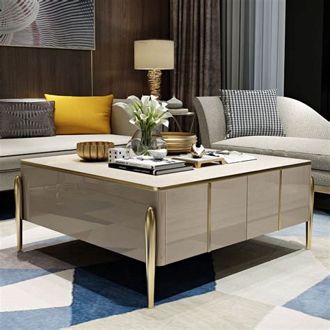 Spice up your living room with this modern stylish coffee table. Adorned by a gold finish, it ...