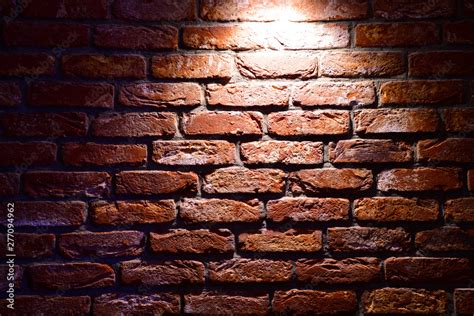 Spotlight above the Brick wall. Brick wall texture. Red brick wallpaper ...