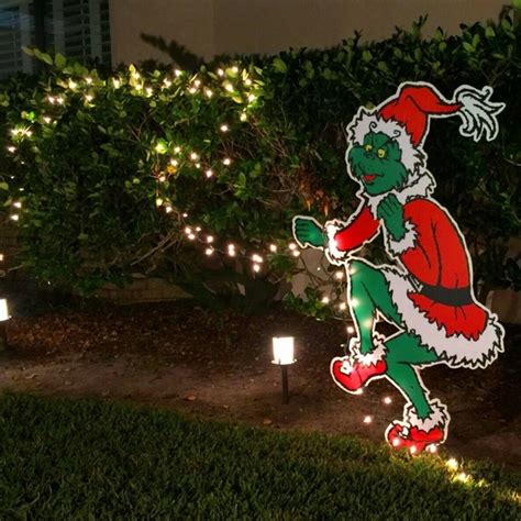 This Grinch Stealing Christmas Lights Decor is So Clever, It's Sneaky!