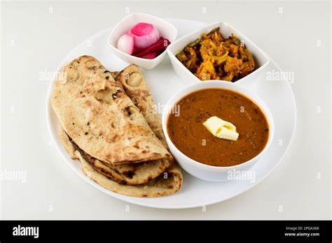 Indian food in plate isolated on white background, dal roti sabji Stock ...