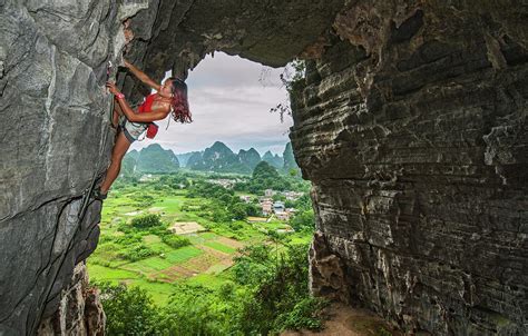 Young Female Climber Climbing At Treasure Cave In Yangshuo, China Photograph by Cavan Images ...