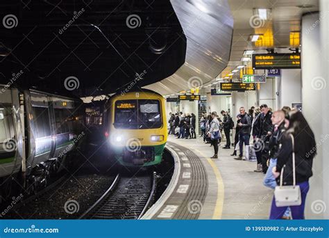 BIRMINGHAM, UK - March 2018 Commuters Waiting for Train Arrival at the ...