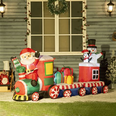 The Holiday Aisle® Christmas Train with Santa Claus, Snowman, Penguin and Gift Boxes Inflatable ...