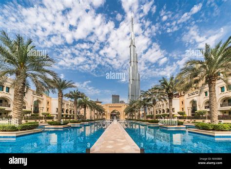 The Palace Hotel and reflective pool with the Burj Khalifa in downtown ...