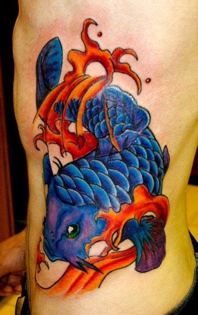 Blue koi fish tattoo. This fish looks so badass. Might be a little too strong looking to fit ...