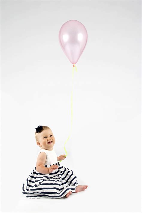 Baby Girl Holding Balloon Free Stock Photo - Public Domain Pictures