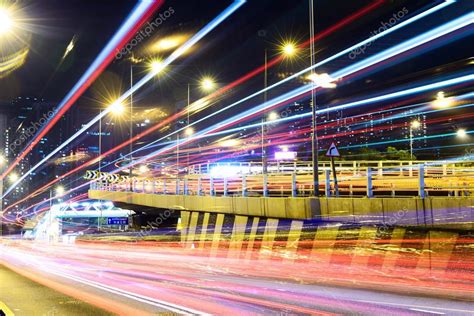 Traffic light trails and modern street Stock Photo by ©zhudifeng 72819735