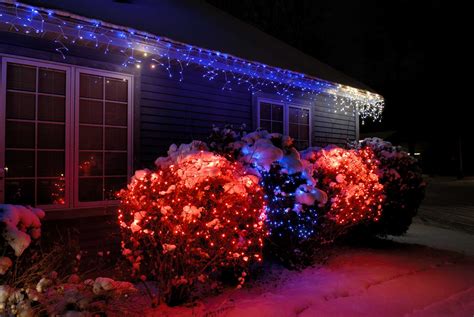 How to Hang Christmas Lights on Bushes