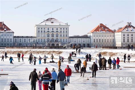 Nymphenburg Palace canals and park during winter, Munich, Germany It is an old tradition in ...