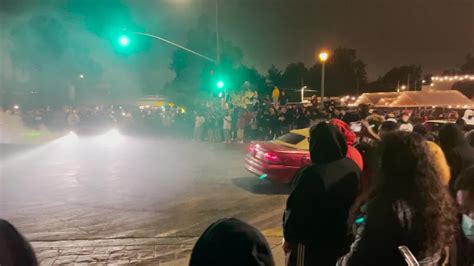 Hundreds watch as cars do donuts in Oakland sideshow - YouTube