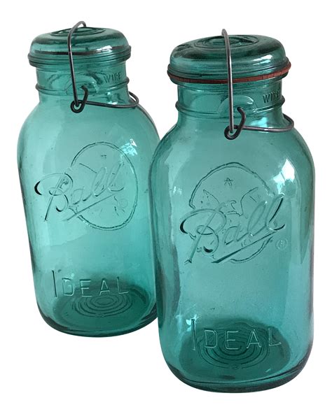 Set of two large teal blue glass Ball jars with wire top security closure and glass lids. Fab ...