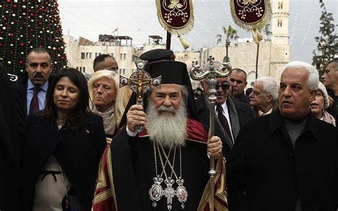 Palestinians mark Orthodox Christmas amid protests of land sales | The Times of Israel