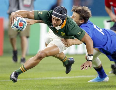 South Africa's Cheslin Kolbe scores a try during the Rugby World Cup Pool B game at Shizuoka ...