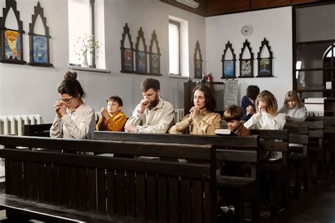 Premium Photo | Medium shot christian family praying at church