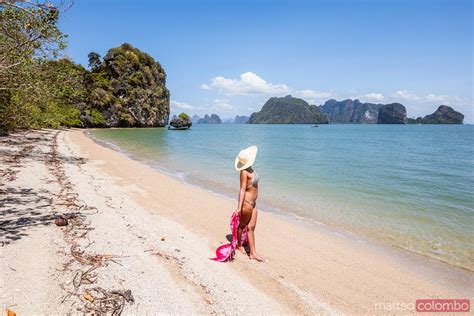 - Woman with sarong relaxing on beach, Phang Nga bay, Thailand ...