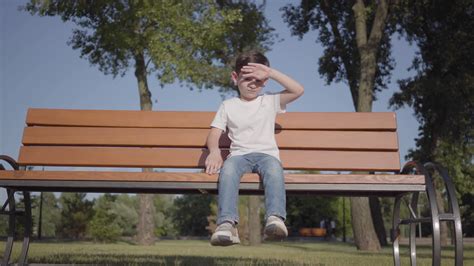 Sweet Child Enjoying Solitude In Park Stock Footage SBV-336752010 - Storyblocks