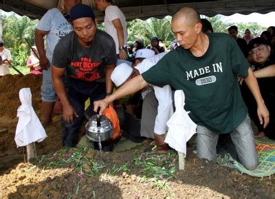 Bidor water surge tragedy: Three siblings buried together | Malay Mail