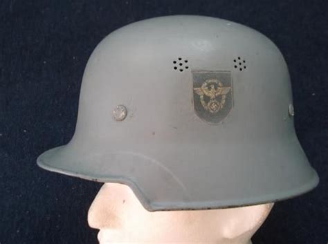 WW2 GERMAN HELMET: REPAINTED GREY WITH ORIGINAL LINER & CHINSTRAP