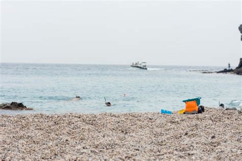 Premium Photo | Playa de los muertos in spain, kid toys on the sand