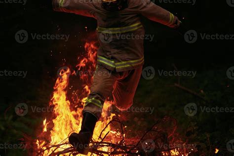 Firefighter in action 11584347 Stock Photo at Vecteezy