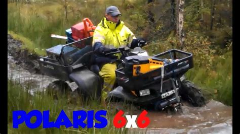 Awesome Polaris 6x6 Sportsman 500 ATV in the woods and in the mud 6 six wheeler with chains ...