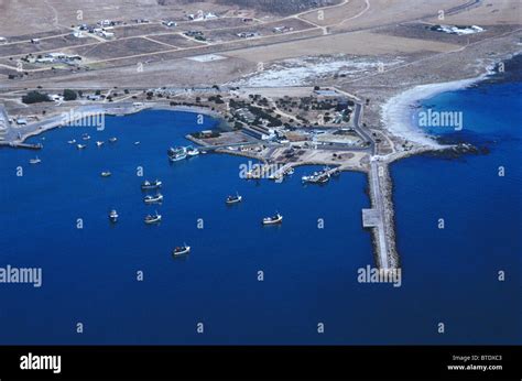 Aerial view of St Helena Bay showing the wharf and scattered fishing trawlers anchored in the ...