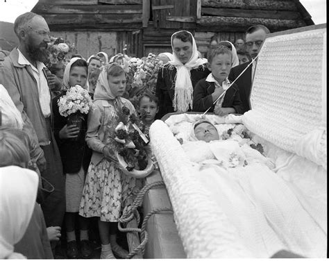 Open casket funeral with child holding flowers | Accession N… | Flickr