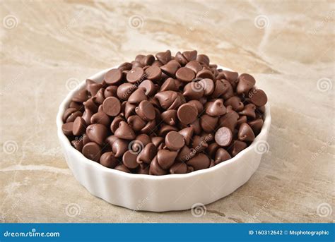 Bowl of chocolate chips stock photo. Image of cocoa - 160312642