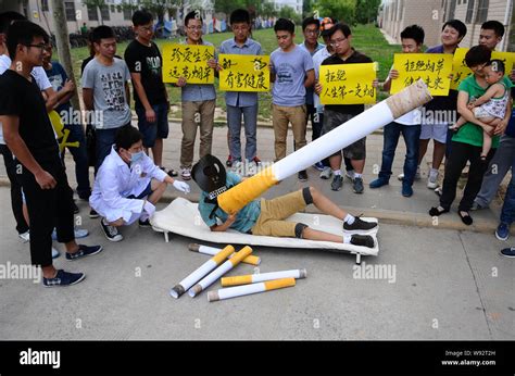 Dressed up students stage a campaign marking the World No Tobacco Day ...