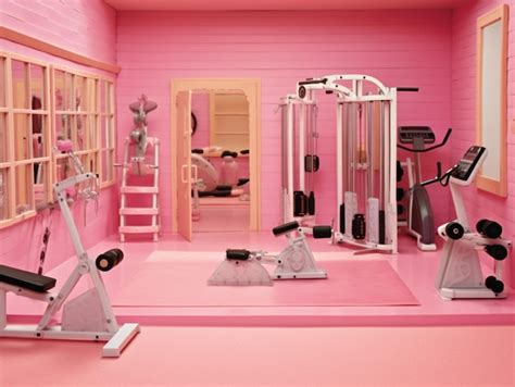 Premium Photo | A pink gym with a treadmill and a bench in the corner.