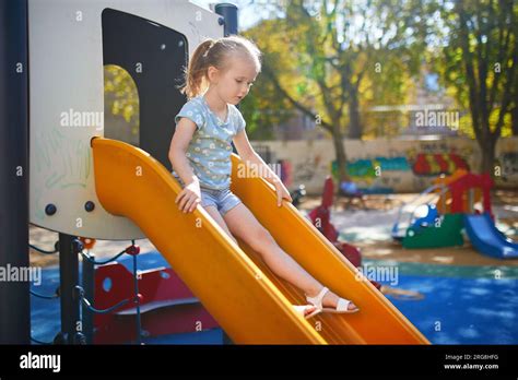 Running down slide hi-res stock photography and images - Alamy