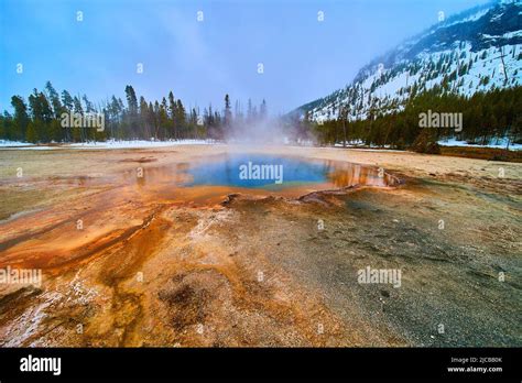 Stunning colorful pools at Yellowstone Biscuit Basin in winter Stock Photo - Alamy