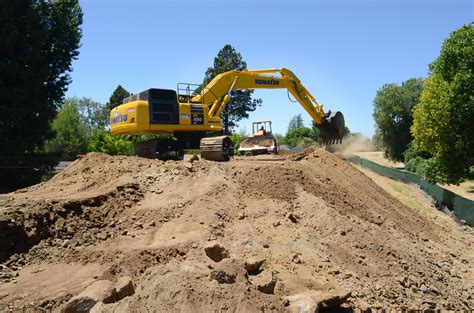 File:Crews excavate the levee on the first day of construction near River Park (9372406000).jpg ...