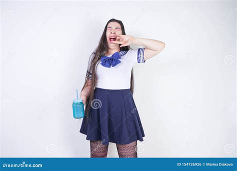 Tired Girl in Anime School Uniform Yawns and Wants To Sleep Stock Photo ...