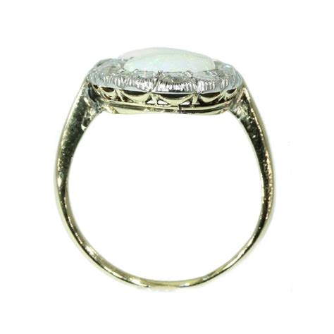 Antique Victorian Engagement Ring with Rose Cut Diamonds and Cabochon Opals For Sale at 1stDibs