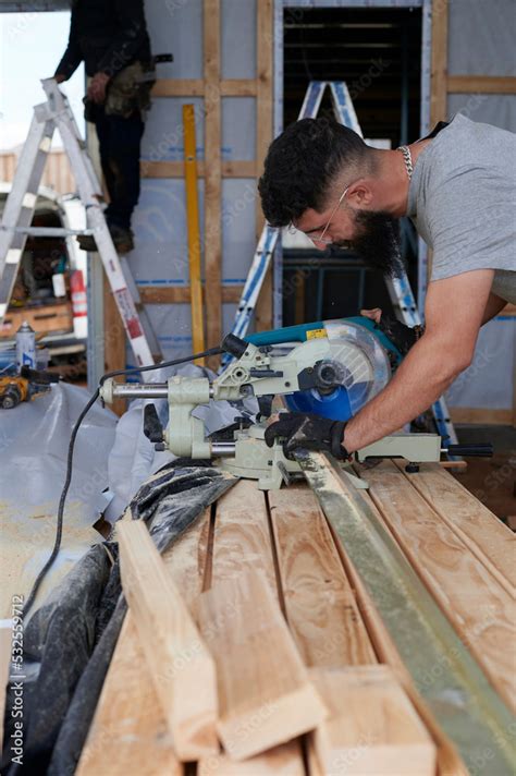 Carpenter using circular saw Stock Photo | Adobe Stock