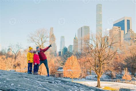 Family of father and kids in Central Park during their vacation in New ...