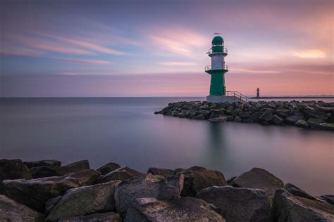 The Guardian | Sunrise At Lighthouse Warnemünde | Baltic Sea Germany | Photo By Robin ...