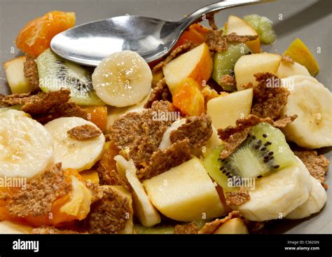 Vibrant fresh Fruit salad and bran flakes Stock Photo - Alamy