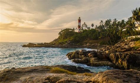 Premium Photo | Beautiful beach sunset with lighthouse