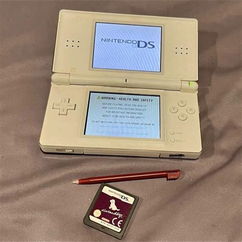 Used white Nintendo DS Lite, comes with red pen and... - Depop