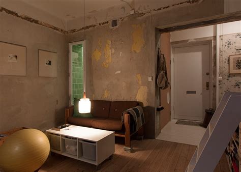 Cleverly Renovated Tiny Apartment Keeps Unfinished Plaster Walls