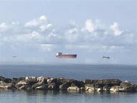 Mirage makes these Black Sea tankers appear to be floating in the air! | Natural phenomena, Fata ...